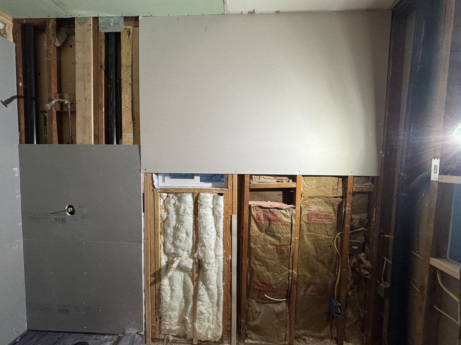 New framing and insulation for extended shower